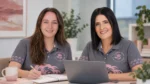 Two members of The BelRose Group team working together at a laptop